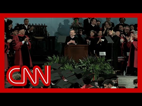 Harvard president gets a minute-long standing ovation as commencement program starts