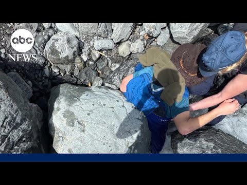 Wife rescues husband from a 700-pound boulder