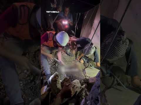Palestinian Civil Defence rescue young girl buried under rubble