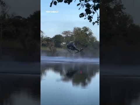 Helicopter crashes into pond during water refill in France