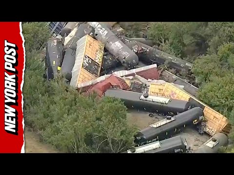 Train Cars Pile on Top of One Another in Fiery Derailment