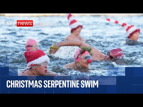 Swimmers compete in the Serpentine Christmas Day Race in Hyde Park