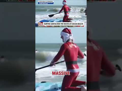 Hundreds of surfing Santas ride the waves in Cocoa Beach #shorts