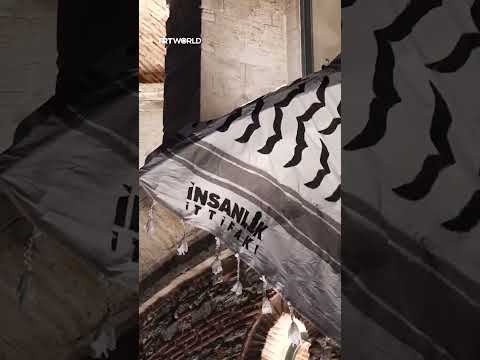 Istanbul’s Galata Tower draped with Palestinian keffiyeh