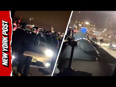 Protesters Surround and Bang on Vehicle with Federal Agents Inside