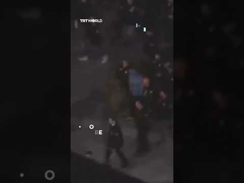 Hooded man thought to be Maduro arrives under guard