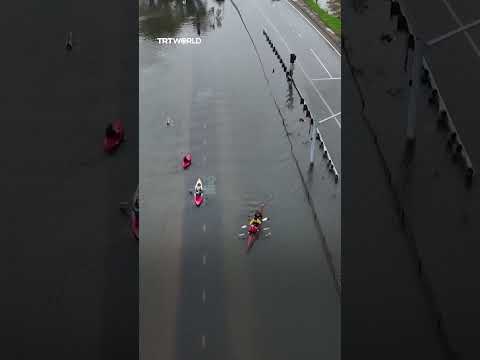Residents kayak in floodwaters during high tide in Marin County of California