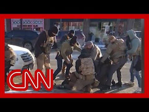 Videos appear to show agent taking gun before Minneapolis shooting