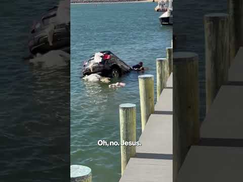 Insane moment good samaritans rescue driver trapped in sinking SUV #shorts