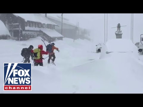 RACE AGAINST TIME: Frantic search for trapped skiers as blizzard worsens