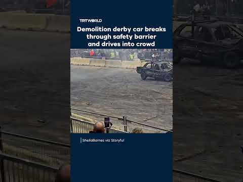 Demolition derby car breaks through safety barrier and drives into crowd