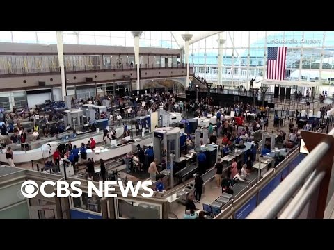 See the long lines, crowds at airports around the U.S.