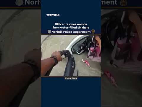 Police pull woman from flooded sinkhole