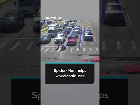 Spider-Man helps wheelchair user stuck at busy pedestrian crossing