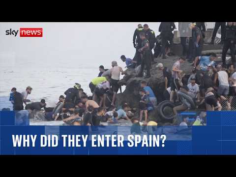 Why did tens of thousands of migrants cross Morocco’s border into Spain?
