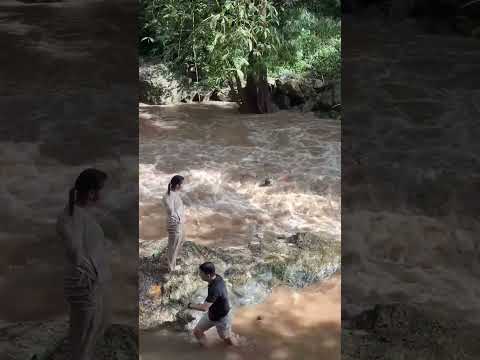 Tourists swept away by flash flood at Thailand waterfall #shorts