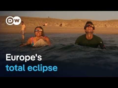 Millions watch as rare solar eclipse darkens Spain and Iceland | DW News