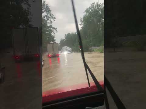 Semi-Truck Overturns and Gets Swallowed by Floodwaters in Indiana #shorts