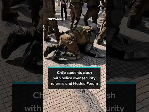 Student protesters clash with police over Chile security reforms and Madrid Forum