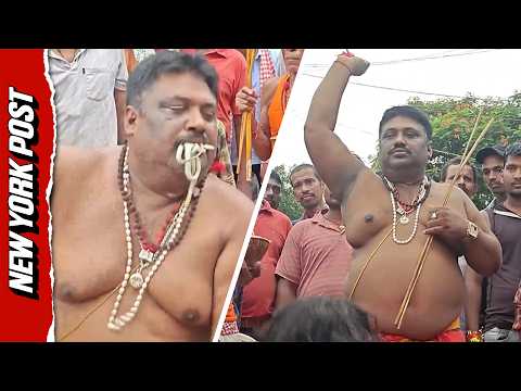 Indian Worshippers Stuff Snakes in Their Mouths Paying Homage to the Serpent God Naga