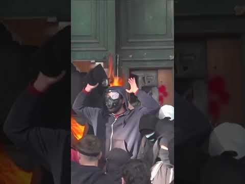 Albanian Police Take Cover Behind Water Cannons as Angry Student Protesters Hurl Objects #shorts
