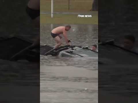 TV reporter dives into floodwaters to save driver in sinking car #shorts #foxnews #news #us